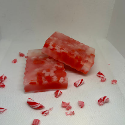 Frosted Cane peppermint soap bars with candy cane pieces for skincare, perfect for holiday gift sets and exfoliation.