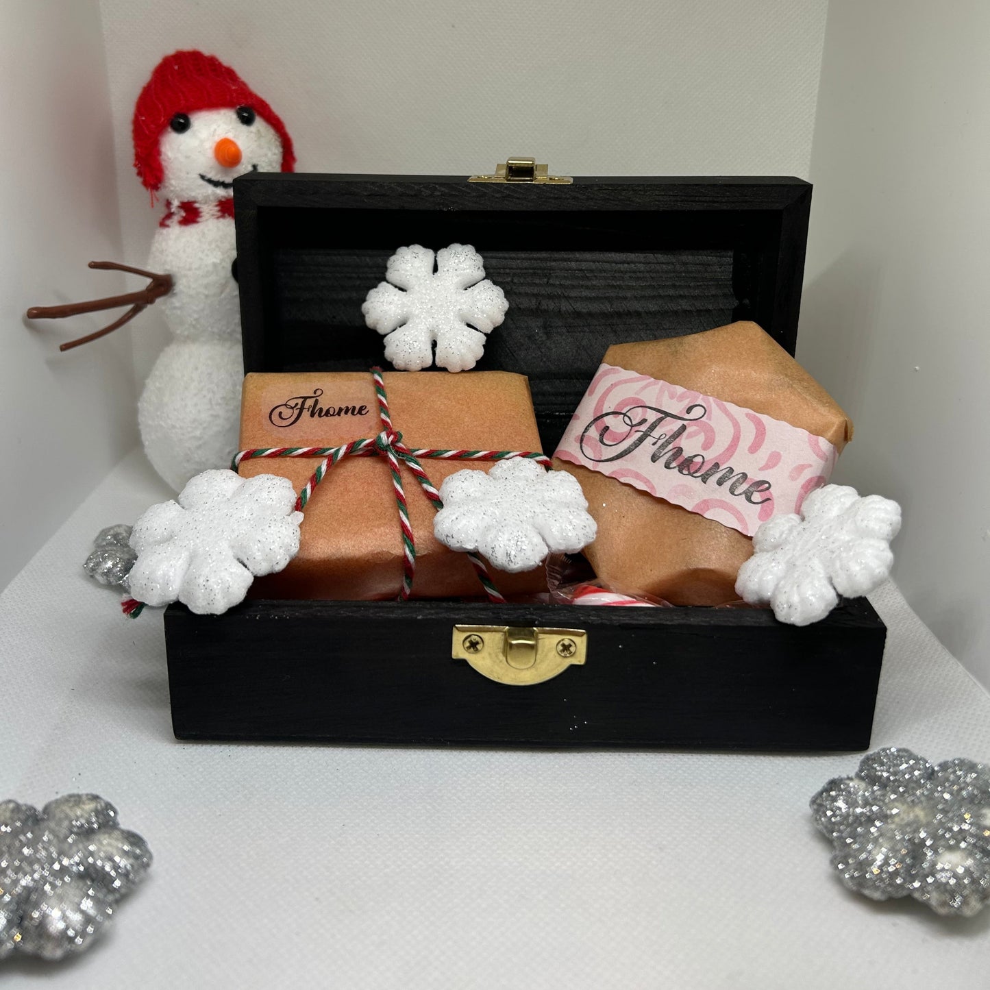 Festive Soap Gift Set in a black wooden box, decorated for the holidays with snowflakes and a snowman.